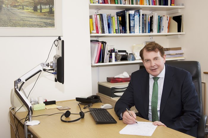 Dr Patrick Magovern at a desk
